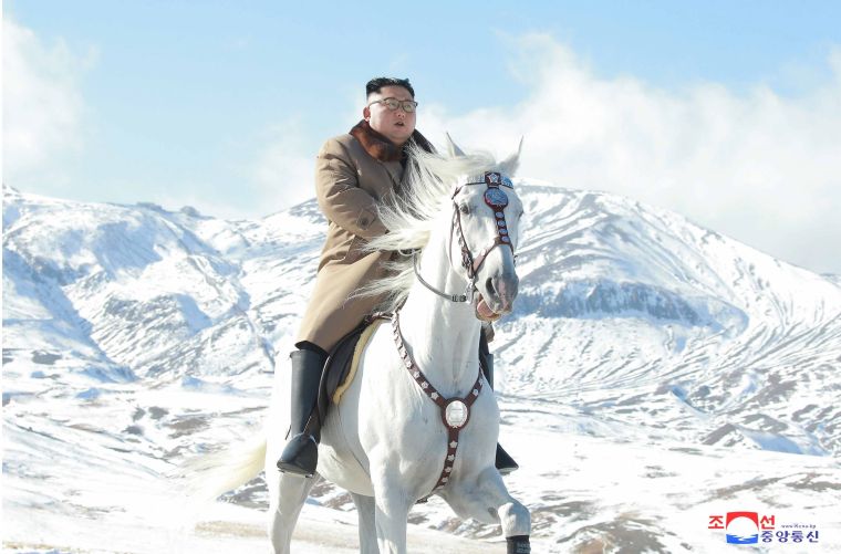 North Korean leader Kim Jong-un rides white horse through snowfall on Paektu Mountain